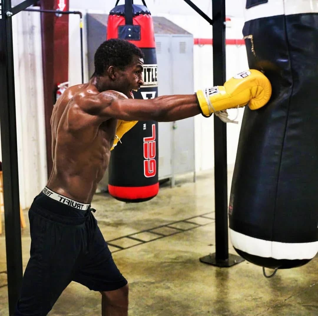 Coach Jalen Clark working a heavy bag
